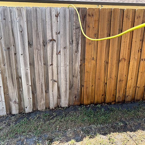 Cocoa fence pressure washing photo. Before & after